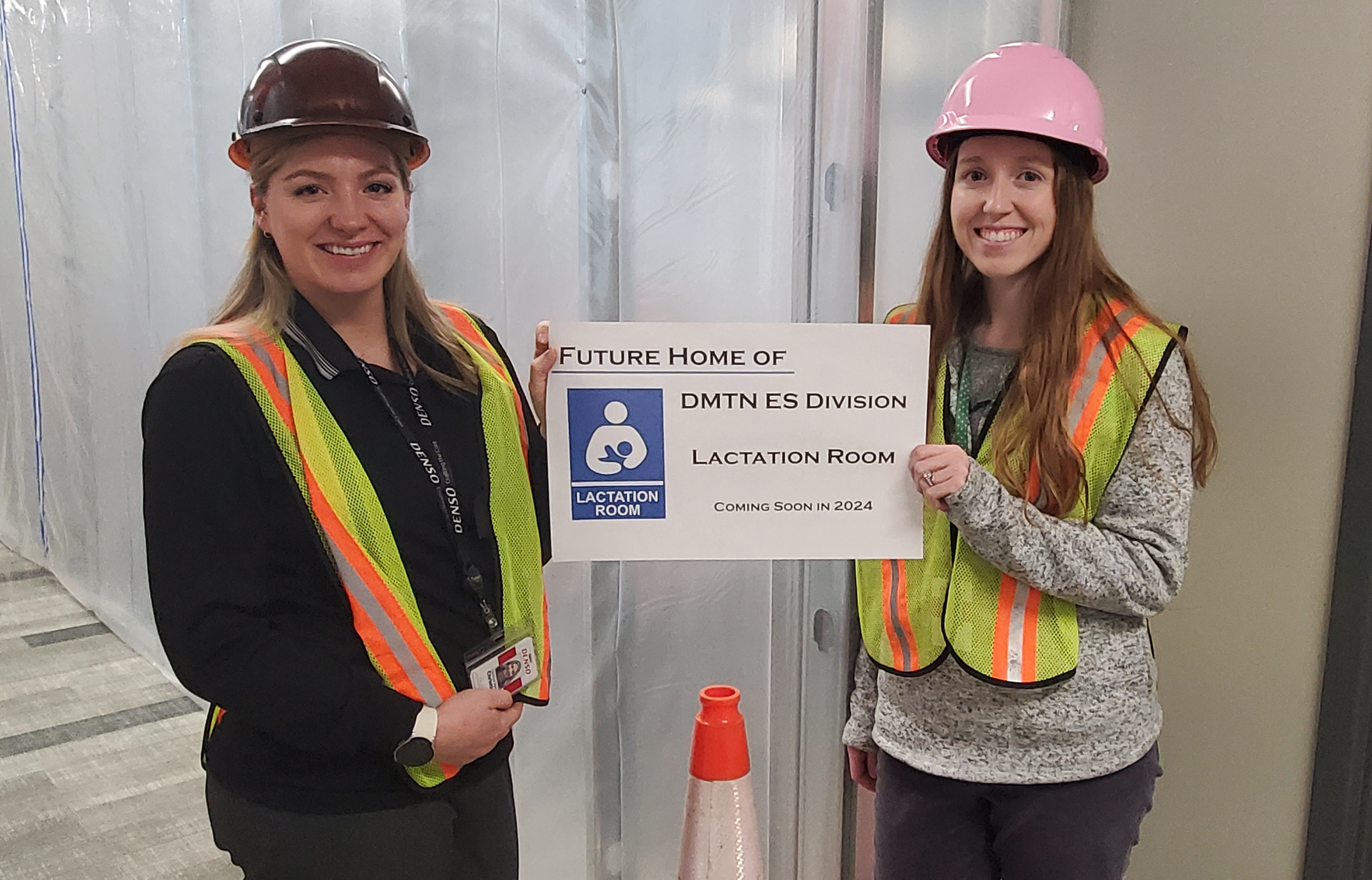Christine Gray and Haley Penney stand in front of construction