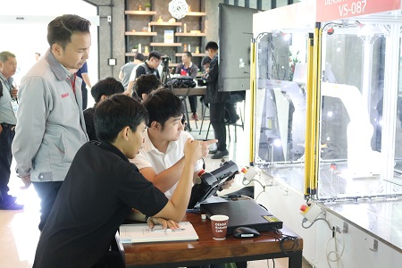 Young Thai engineers studying at a robotics school