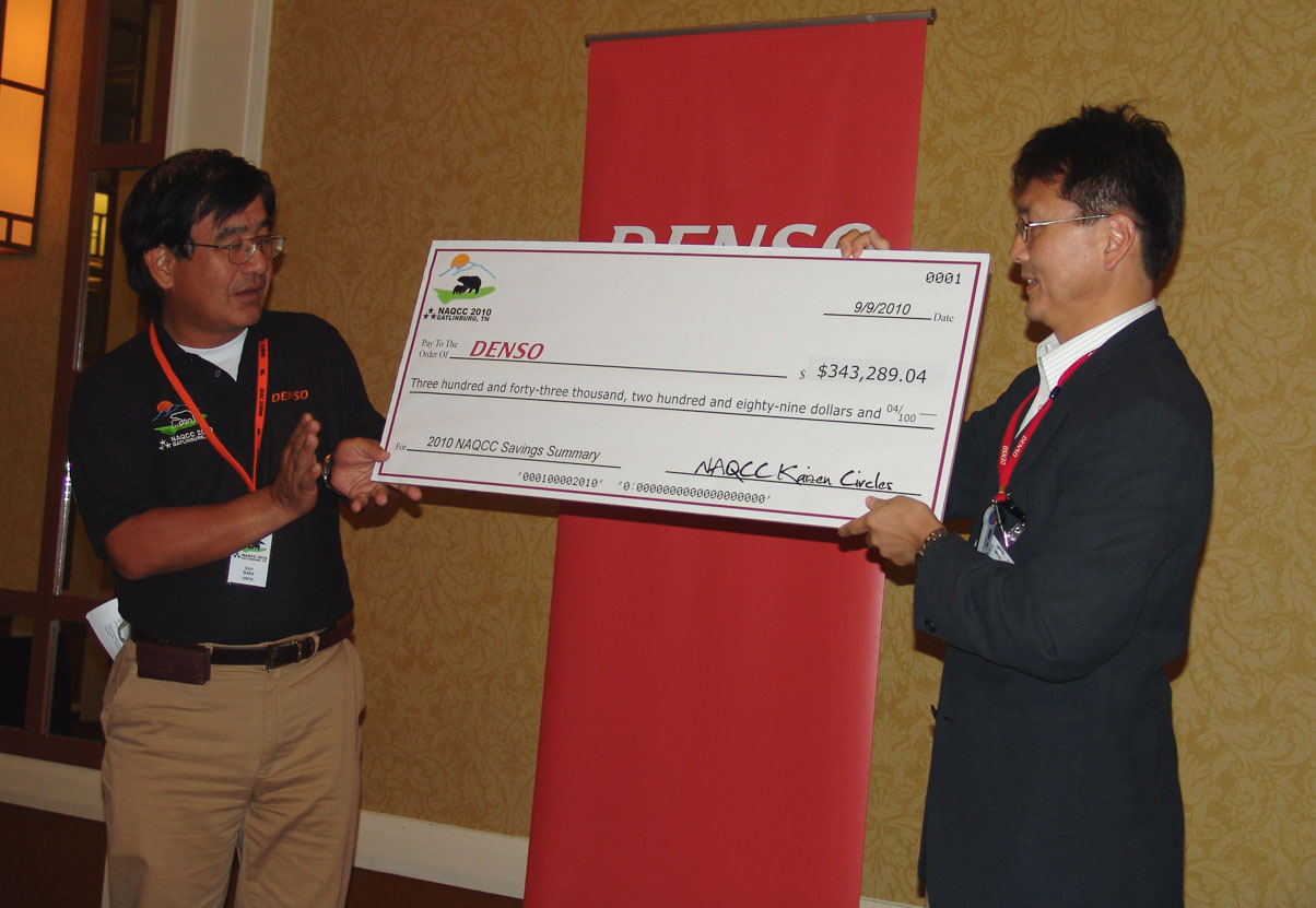 Collectively, teams competing at NAQCC generate annual savings for DENSO. In 2010, a symbolic check representing nearly $350,000 in savings - was presented to DMTN President Van Saka (left) by Quality Engineering senior manager Mick Kanemura. DMTN hosted that year’s competition in Gatlinburg, Tennessee.