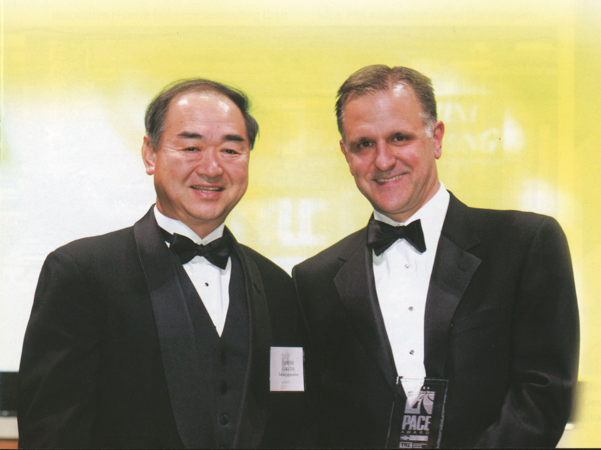 DENSO earned its first PACE Award in 2004 for its very high-pressure, solenoid fuel-injection system (or 1800-Bar Common Rail System), which reduced pollutants from vehicle exhaust gas while increasing engine power. Pictured: Hiromi Tokuda (left), director, Diesel Injection and Gasoline Injection Production Division, accepted the award on behalf of DENSO. Read the story in Vision, Volume 10 Issue 2.