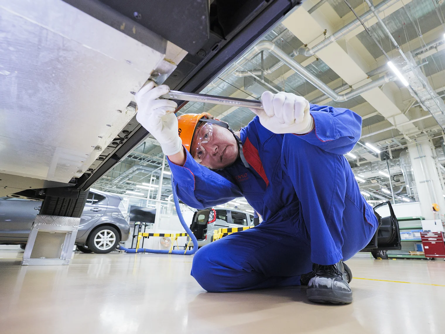 Ueda working on the DWPT system using a customized mobile lifting platform