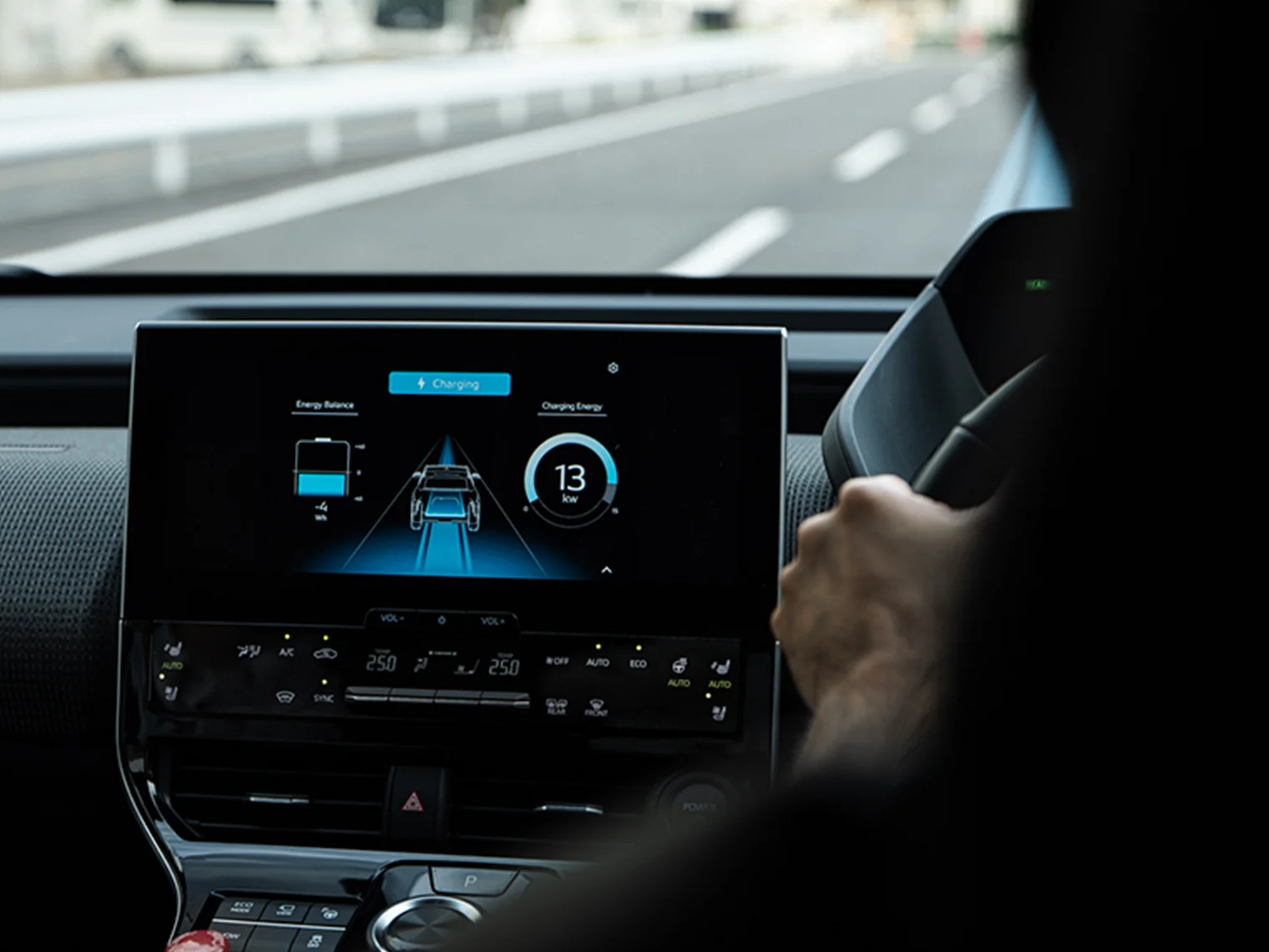 An infotainment screen displaying the charging status for wireless power transfer while driving, charging energy, and the energy balance.