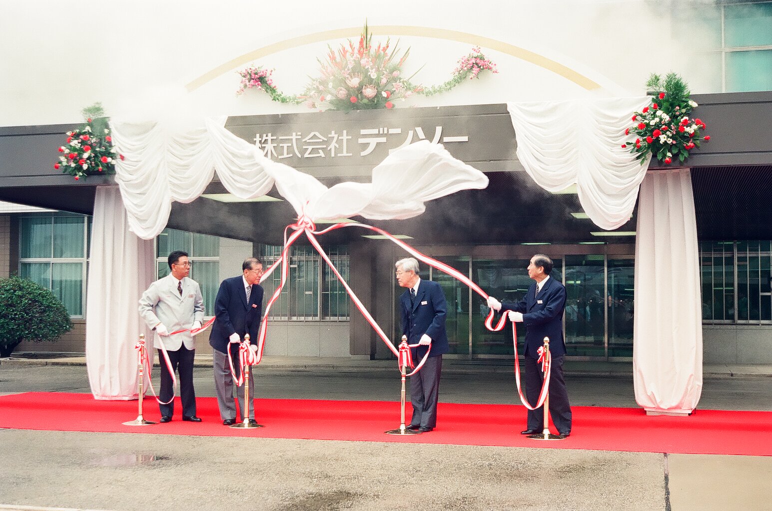 4 men unveil new name on building