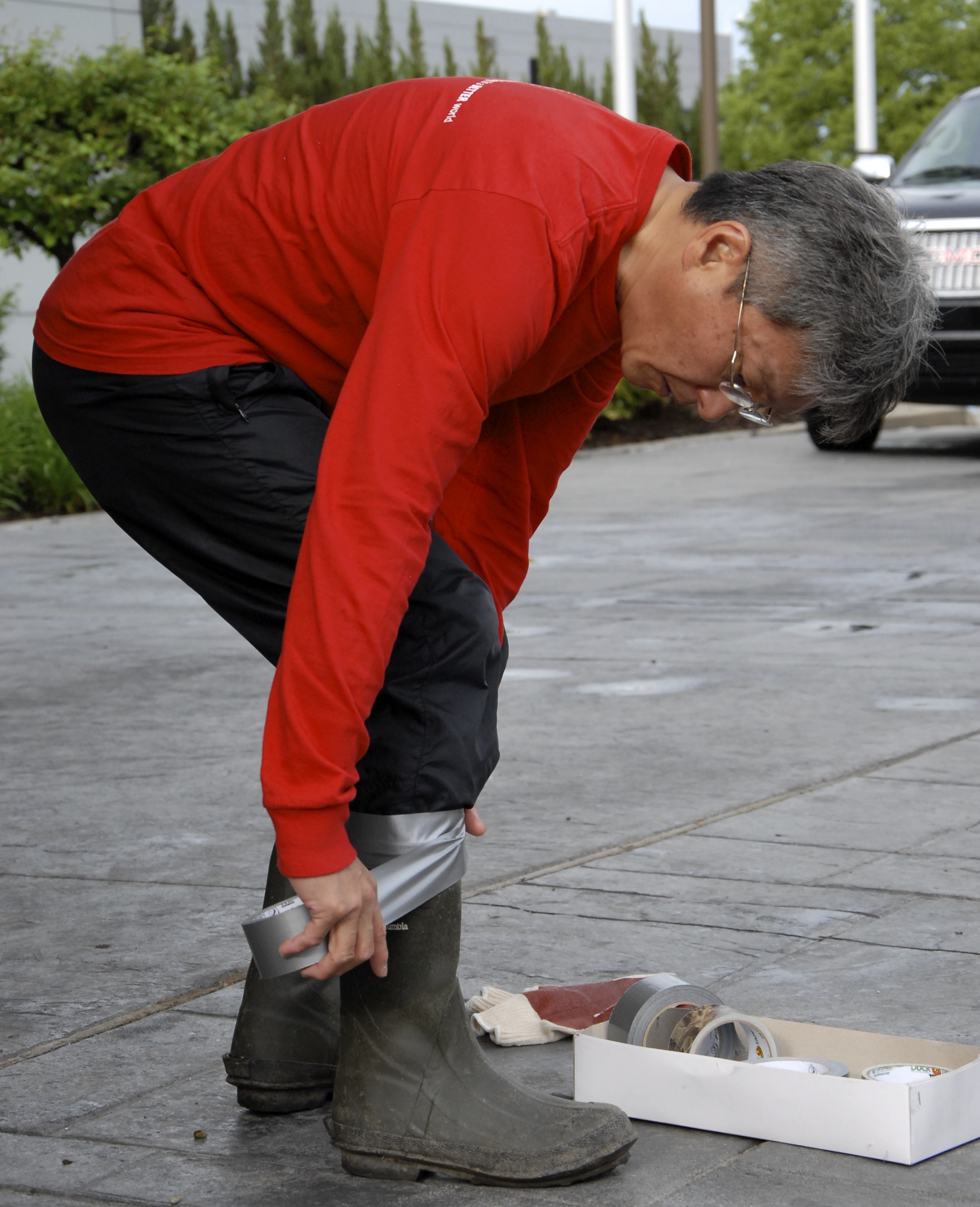 Man tapes boots with duct tape
