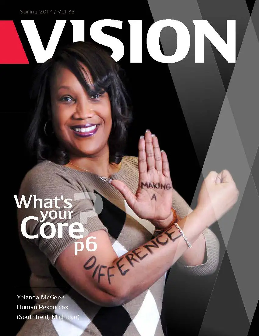 Yolanda Poses with writing on her skin stating Making a difference on a magazine cover