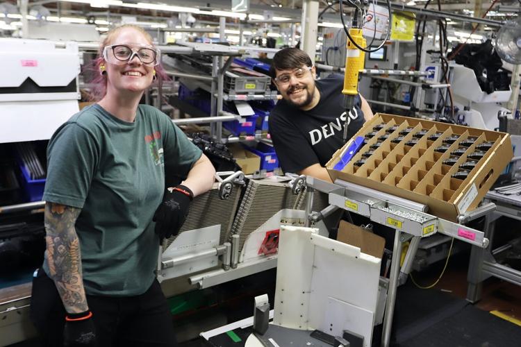 Two DENSO Manufacturing Canada Associates Smiling