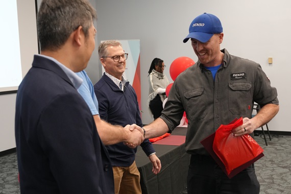 Apprentice Shakes Hands with DENSO Executives