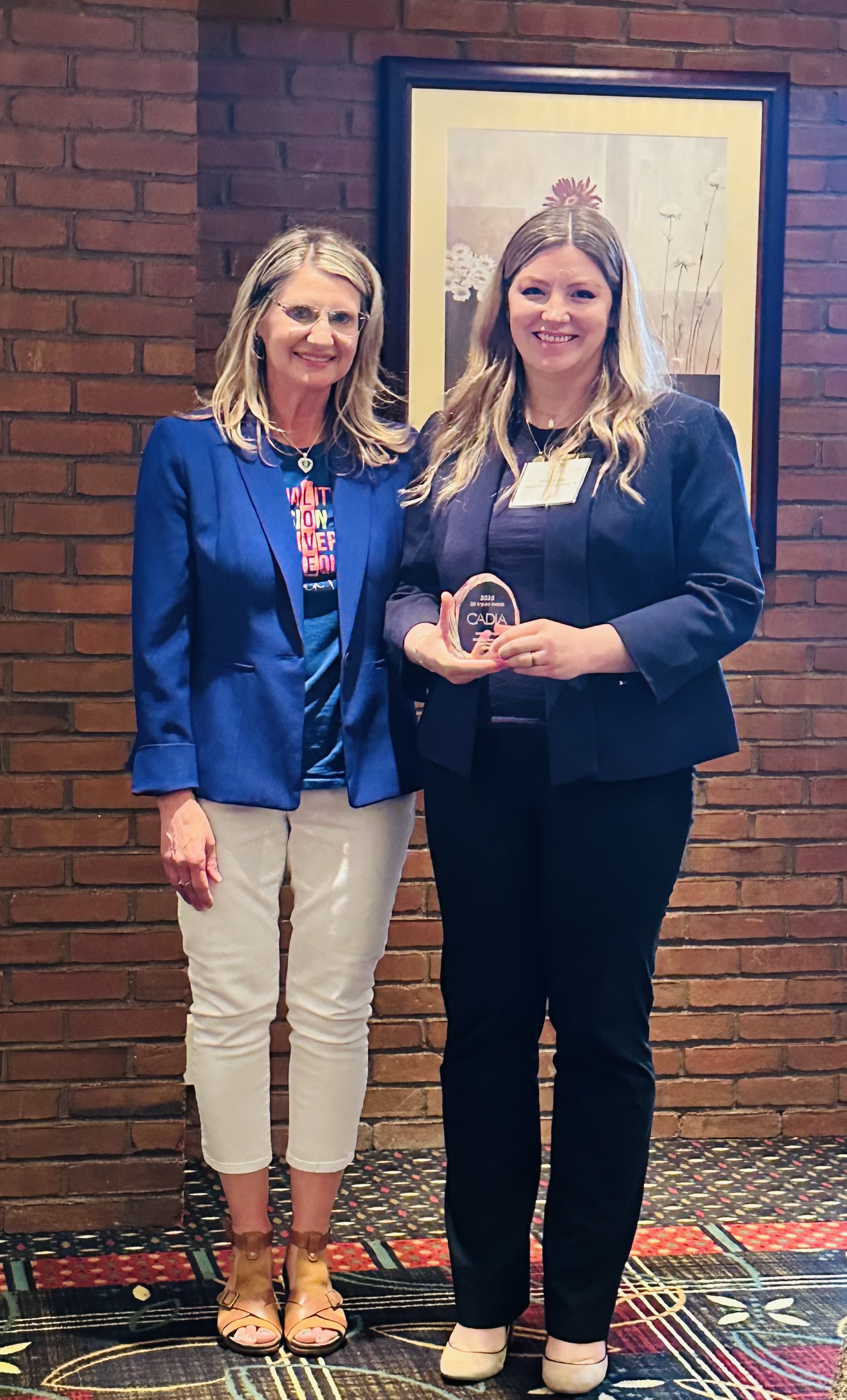 Christine Gray accepts the CADIA Impact Award