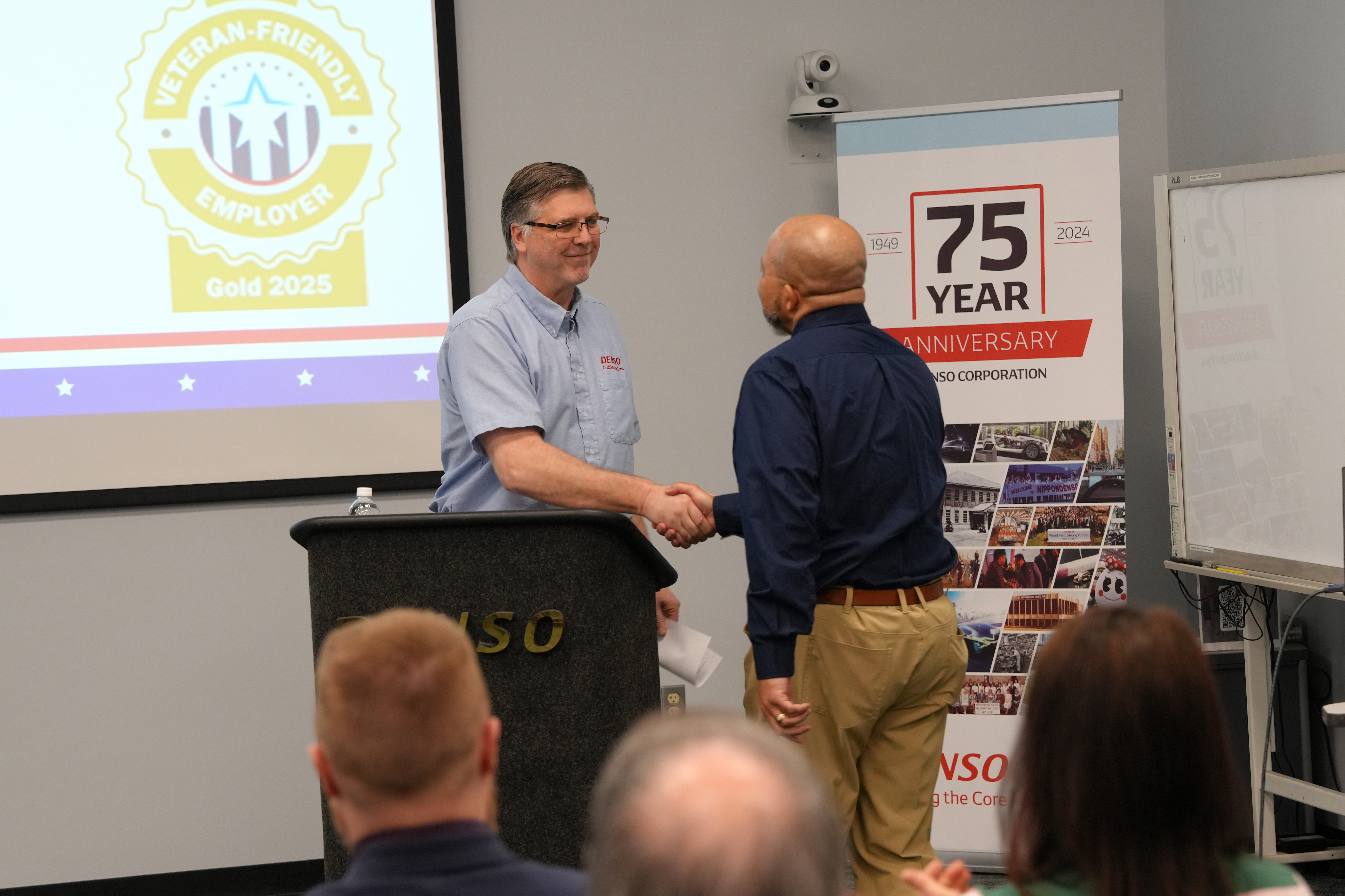 Presenter Shakes Hands